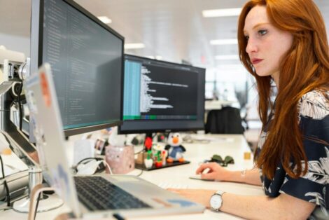 woman coding on computer